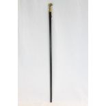 Ebonized walking cane with skull top with lifting mechanism