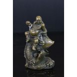 Chinese bronze Buddha riding fish, four character mark to base