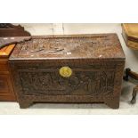 Mid 20th century Camphor wood Blanket Box / Chest, heavily carved with a scene of boats on rough