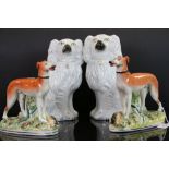Pair of Staffordshire greyhound figures and a similar pair of spaniels