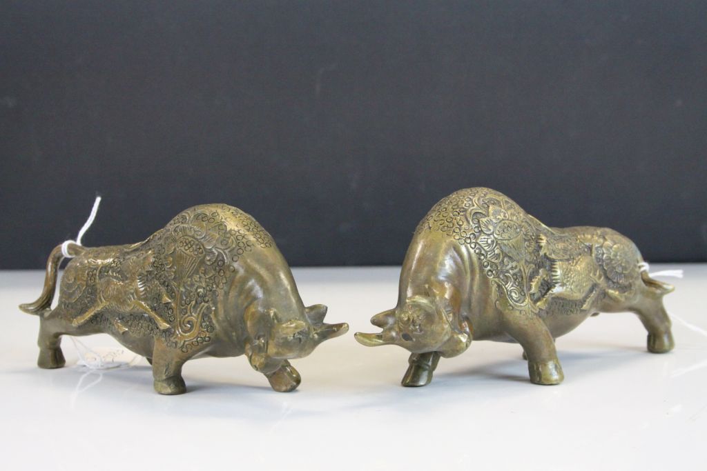 Pair of Chinese bronze bulls, marked to base