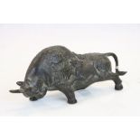 Oriental bronze bull decorated with dragons and character marks to back