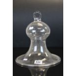 An antique glass bell cloche