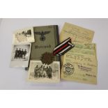 A World War Two / WW2 German Wehrpass Together With A Small Collection of Related Photographs And