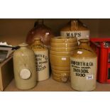 An antique Thos Horne Brandy Merchant of Morton stoneware flagon three other flagons a spirit barrel