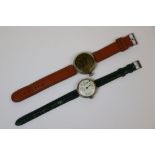 Two Vintage World War One Era Trench Watches, One Having A Black Dial Made By Ingersoll And The