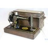 Vintage cased Singer sewing machine with paperwork