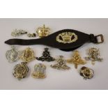 A Collection Of Approx Thirteen British Army Regimental Cap Badges To Include Royal Artillery, Royal