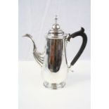 An Irish silver Georgian style coffee pot with wooden handle