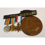 A World War One / WW1 Death Plaque And Full Size Medal Trio Comprising Of The British War Medal, The