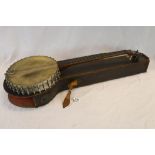 A vintage cased Lyons and Healy banjo.