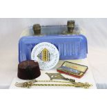 Box of sundries to include Hohner 64 chromonica, vintage fez, two oil lamps and other metal ware