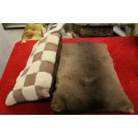 A vintage animal hide together with two pillows