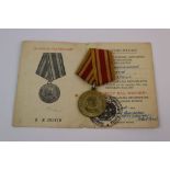 A Russian / Soviet World War Two / WW2 1945 Victory Over Japan Medal Complete With Original Issue