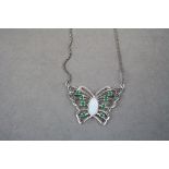 Silver necklace in the form of a butterfly with opal panel
