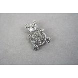 a silver and marcasite bear brooch