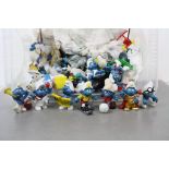 Box of mixed vintage Smurf figures & a small quantity of ceramic Wade Whimsies