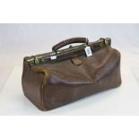 Antique leather Gladstone style bag with brass mounts from a GWR Guardsman