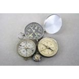 Four compasses including miniature pendant set in agate