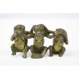 Three wise monkeys in bronze