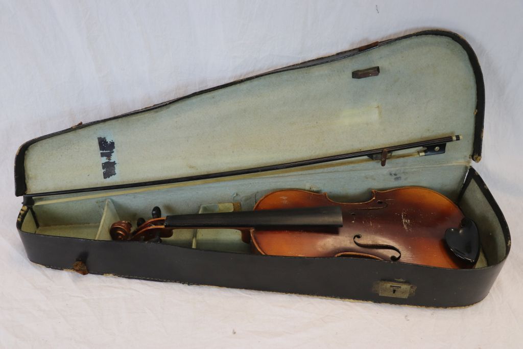 A vintage cased violin and bow.