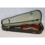 A vintage cased violin and bow.
