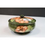 Moorcroft Pottery lidded bowl with "Hibiscus" pattern with label to base & approx 14.5cm diameter