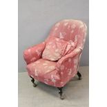 19th century Ladies Armchair with Loose Covers and raised on turned front legs with castors