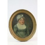 Early 19th century oval oil on canvas of a young woman, unsigned, approx. 31 x 26cm