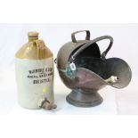 Antique copper coal scuttle, three antique fenders, a stoneware flagon marked Wigmore & Son Bristol