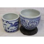 Oriental blue & white jardiniere with dragon decoration, one other similar with floral decoration,