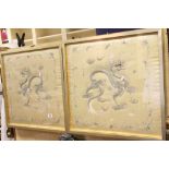 Pair of early 20th Century framed silk oriental panels with embroidered dragon decoration