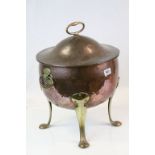 Arts & Crafts lidded Copper Coal Bucket with four Brass feet, twin handles and fixed lid handle,