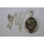 Silver picture locket with embossed image of a horse