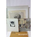 Quantity of unframed pictures to include portraits and a oil on canvas street scene, signed E