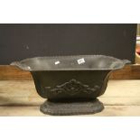 Cast iron antique planter with classical scrolling decoration