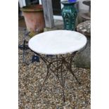 Iron work and marble topped garden table