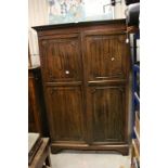 Georgian Style Mahogany Wardrobe with Twin Panel Doors opening to reveal a hanging space, raised