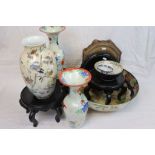 Group of oriental ceramics to include bowls and vases and a quantity of hardwood stands