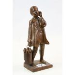 Vintage Hand Carved Wooden Figure of a Boy holding a bucket of firewood signed Soliza Rio, 27cms