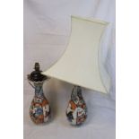 Pair of antique Chinese vases converted to lamps with floral decoration and figurative panels