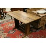 Arts & Crafts oak table with label below "Bowmans Unit Furniture"