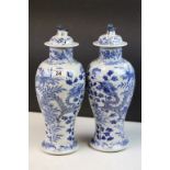 Pair of vintage Chinese blue & white lidded ceramic Vases with Dragon decoration & four character