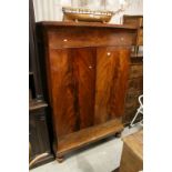 19th century Continental Mahogany Cupboard with Two Panel Doors and raised on Ball Feet, 124cms wide