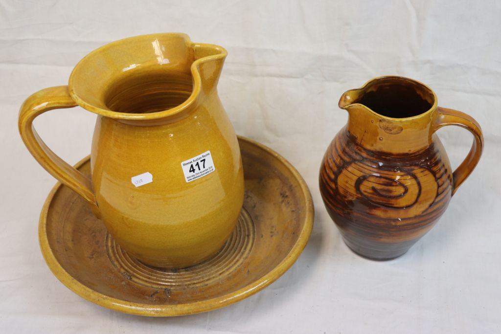 Studio pottery jug with slip ware scrolling decoration and a vintage pottery jug and bowl