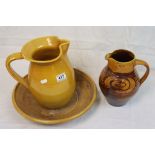 Studio pottery jug with slip ware scrolling decoration and a vintage pottery jug and bowl