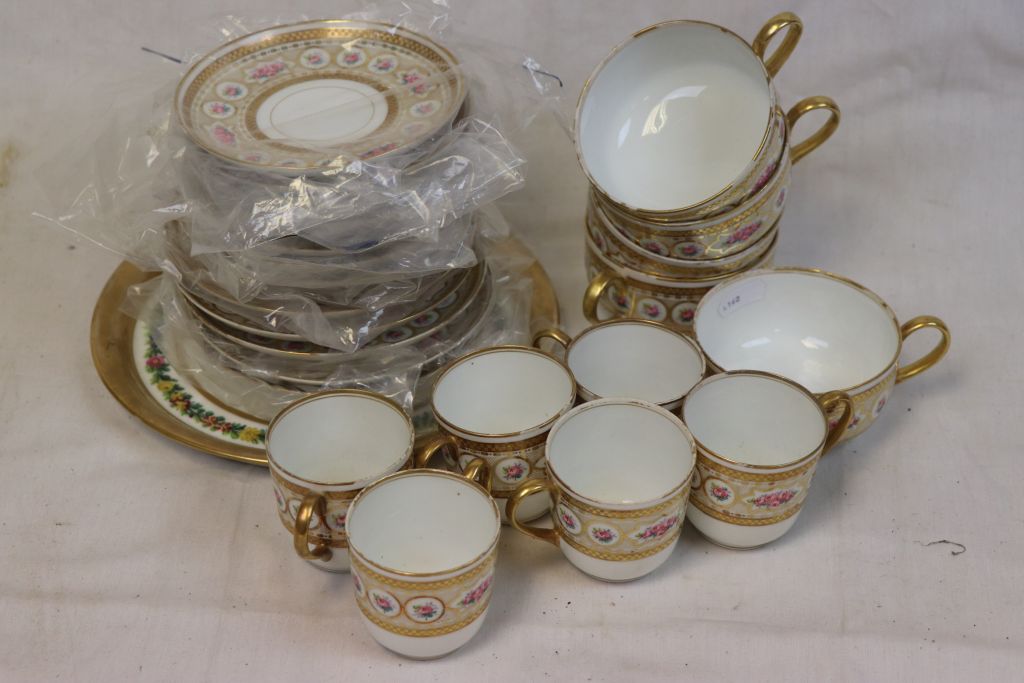 20th century Limoge Arnold Rub floral decorated coffee cups and tea cups and saucers