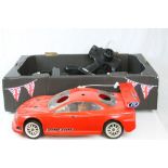 A Kyosho fuel Alfa-Romeo remote control car together with two remote control car fuel chassis and