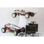 Two Tamiya Super Sabre remote control cars with remote controls & 1987 manual within a Beaties