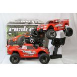 Two HPI Racing nitro powered Rush Evo remote control cars with remote controls